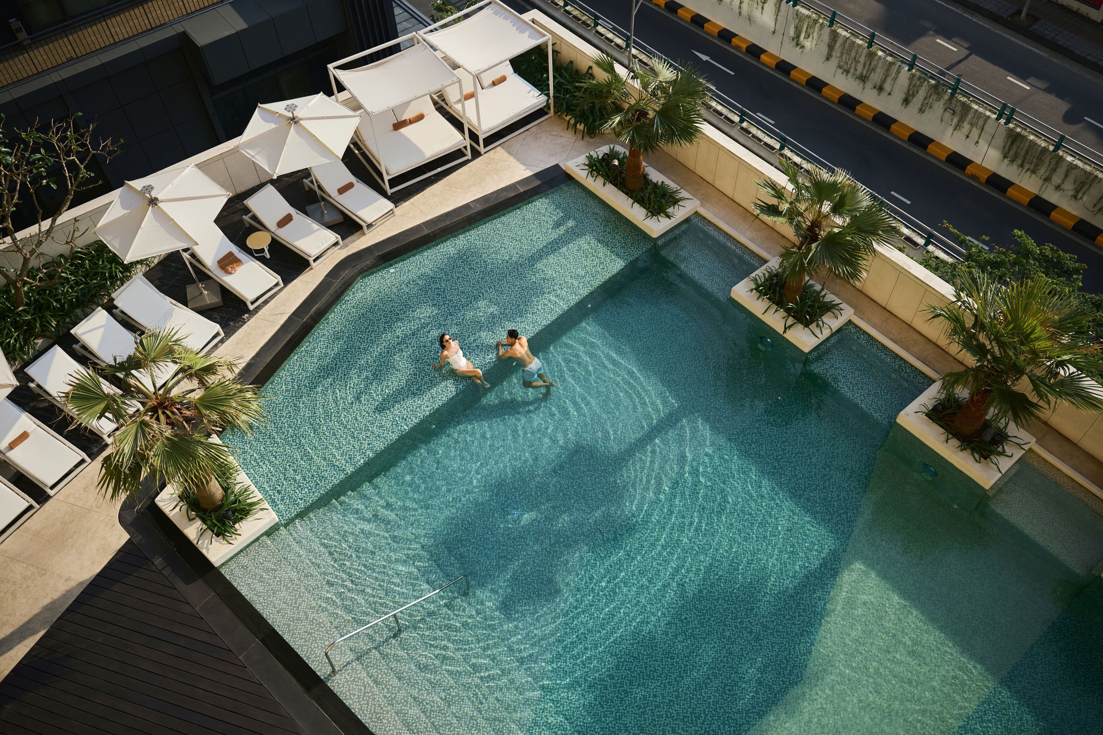 Outdoor pool, open 6:00 AM to 10:00 PM, pool umbrellas, sun loungers
