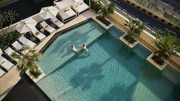 Outdoor pool, open 6:00 AM to 10:00 PM, pool umbrellas, sun loungers