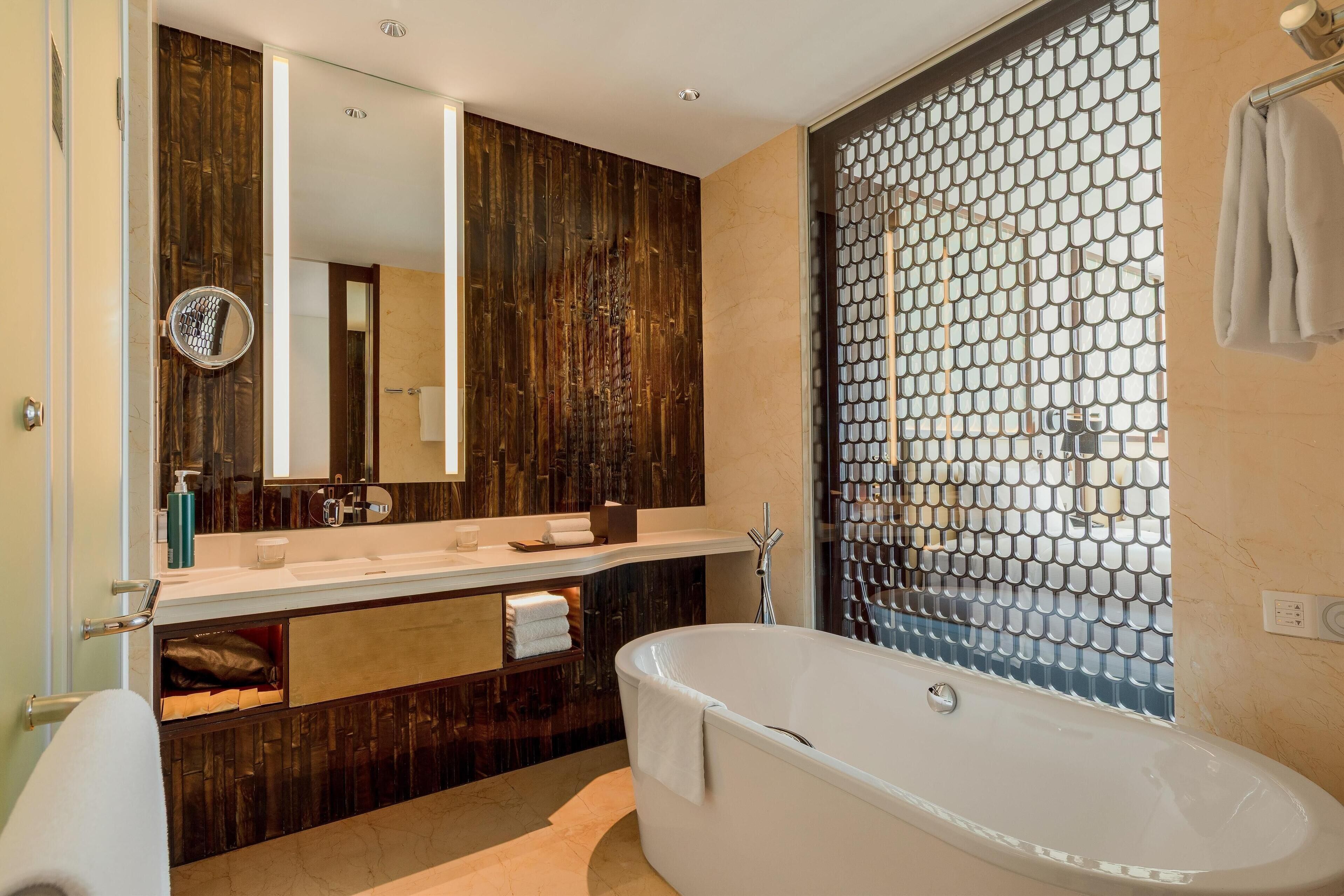 separate bathtub and shower, free toiletries, hair dryer, bathrobes