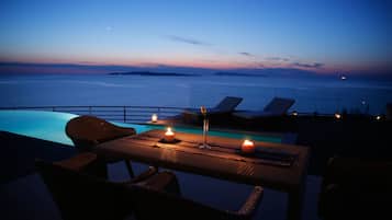 Outdoor pool, open 8:00 AM to 8:00 PM, pool umbrellas, pool loungers