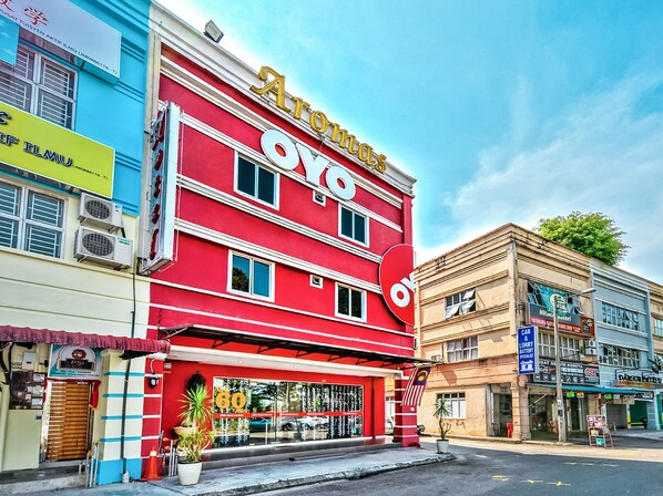 A red building with a large sign reading "Aro".