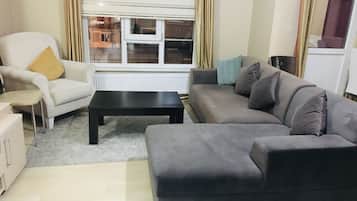 Superior Condo | Living area | 19-inch LED TV with satellite channels, TV