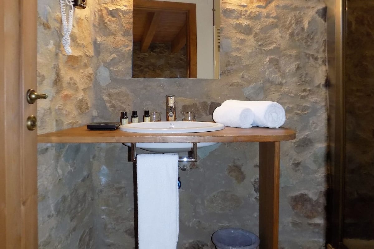 standard double room, 1 double or 2 single beds, mountain view | bathroom | shower, hair dryer, towels, soap