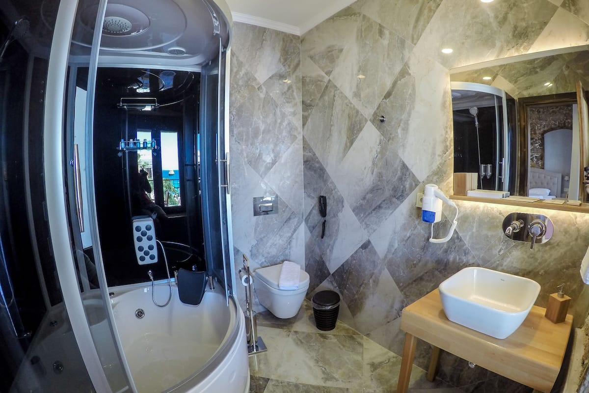 suite, sea view | bathroom | designer toiletries, hair dryer, slippers, towels
