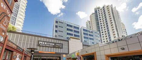 A shopping area with a Meriton Retail Precinct, a McDonald's, and a restaurant named 'Barber'.