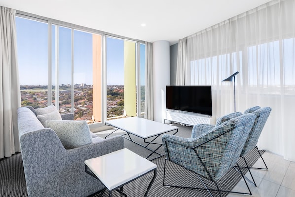 2 Bedroom Suite | Living area | 55-inch flat-screen TV with digital channels, TV