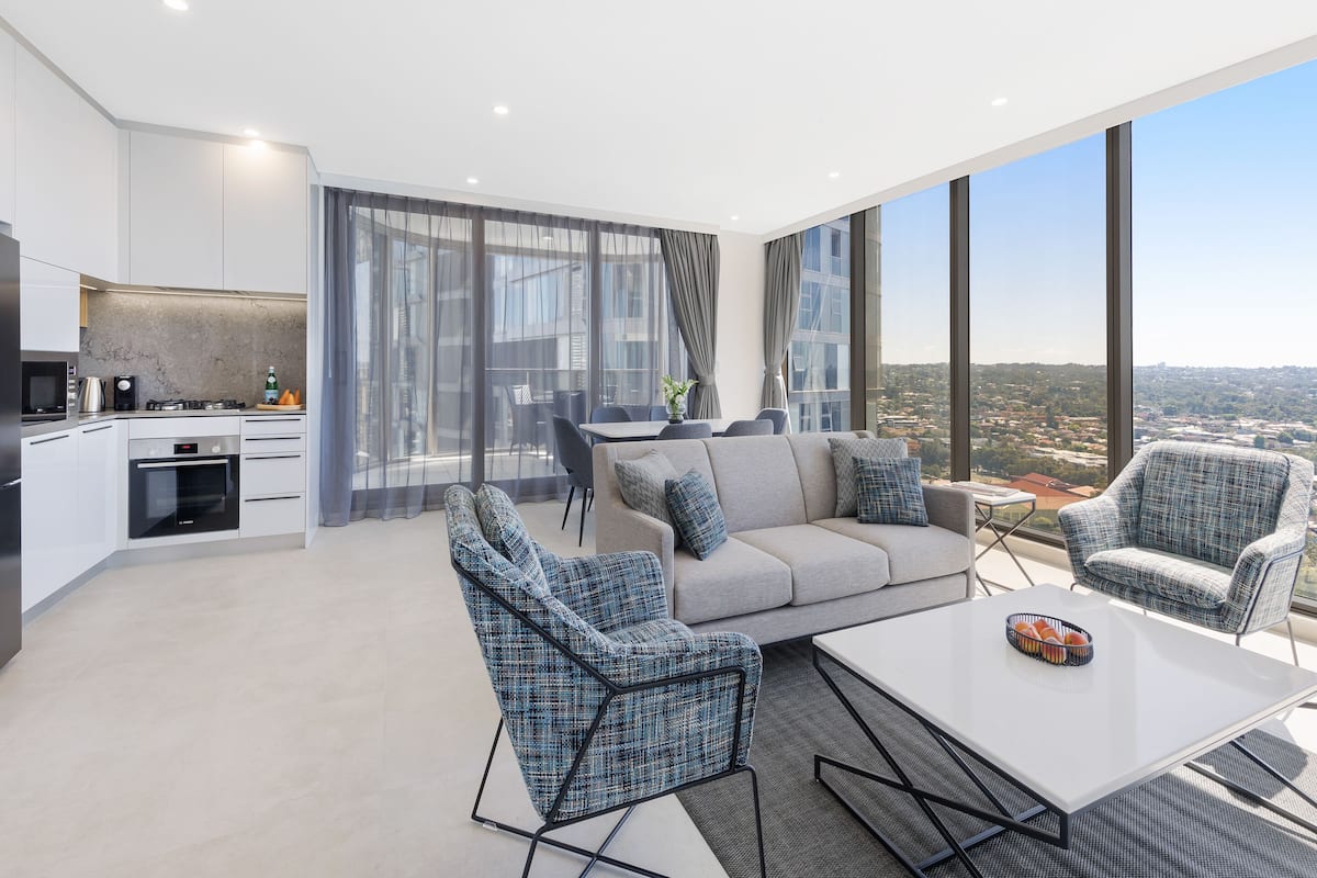 2 bedroom luxury suite | living area | 55-inch smart tv with digital channels, tv, streaming services