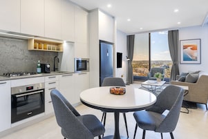 1 Bedroom Suite | Private kitchen | Fridge, microwave, stovetop, dishwasher