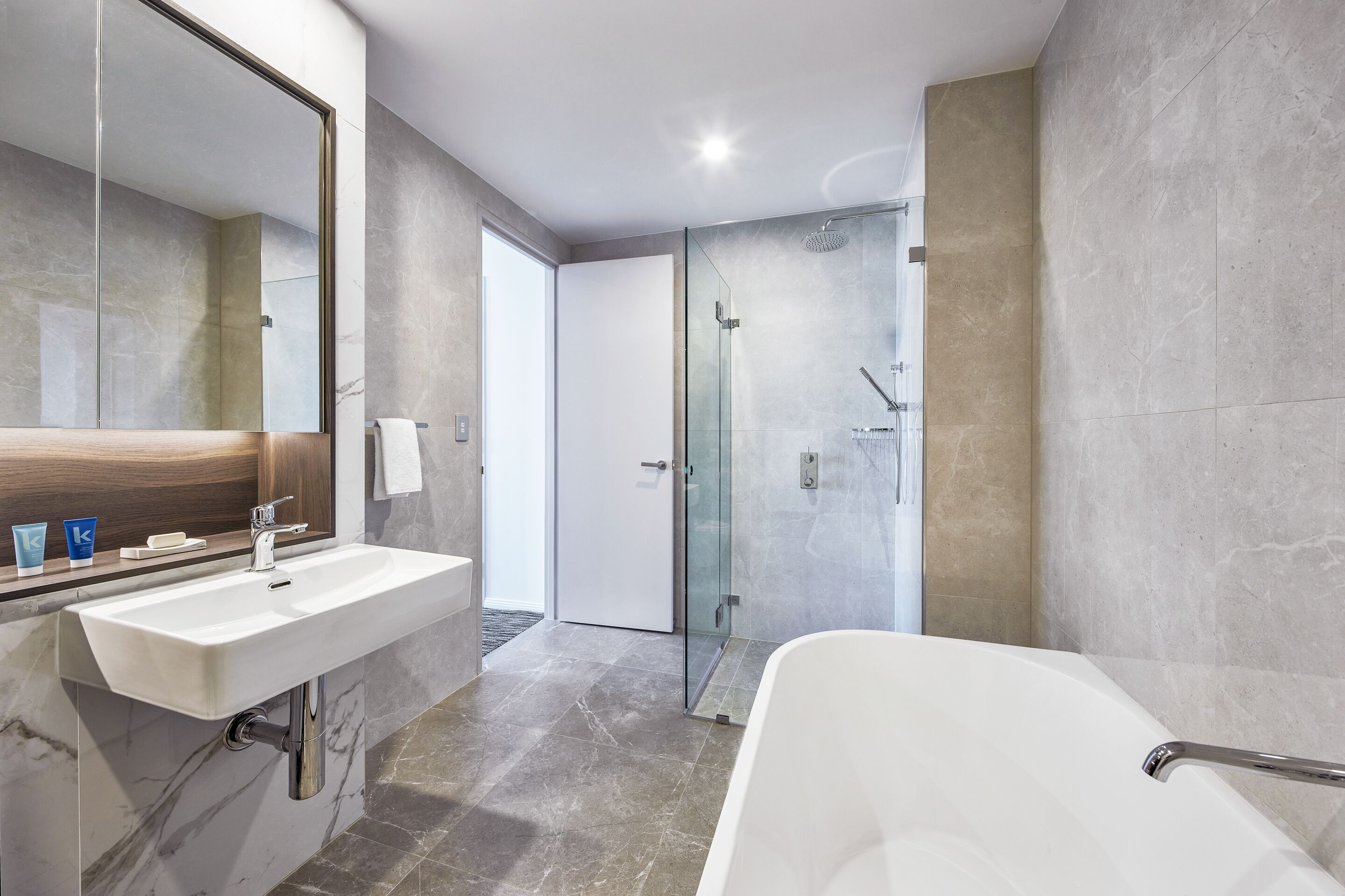 designer toiletries, hair dryer, towels, soap