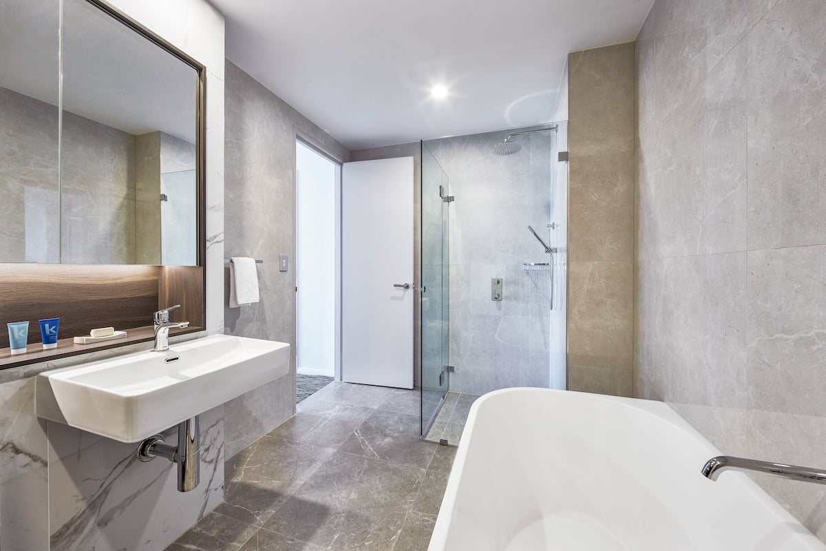 designer toiletries, hair dryer, towels, soap