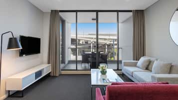 1 Bedroom Suite | Living area | Flat-screen TV