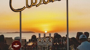 A bar with a sign reading "Cubanito" and various bottles of alcohol. - Cubanito Ibiza (Sant Antoni de Portmany)