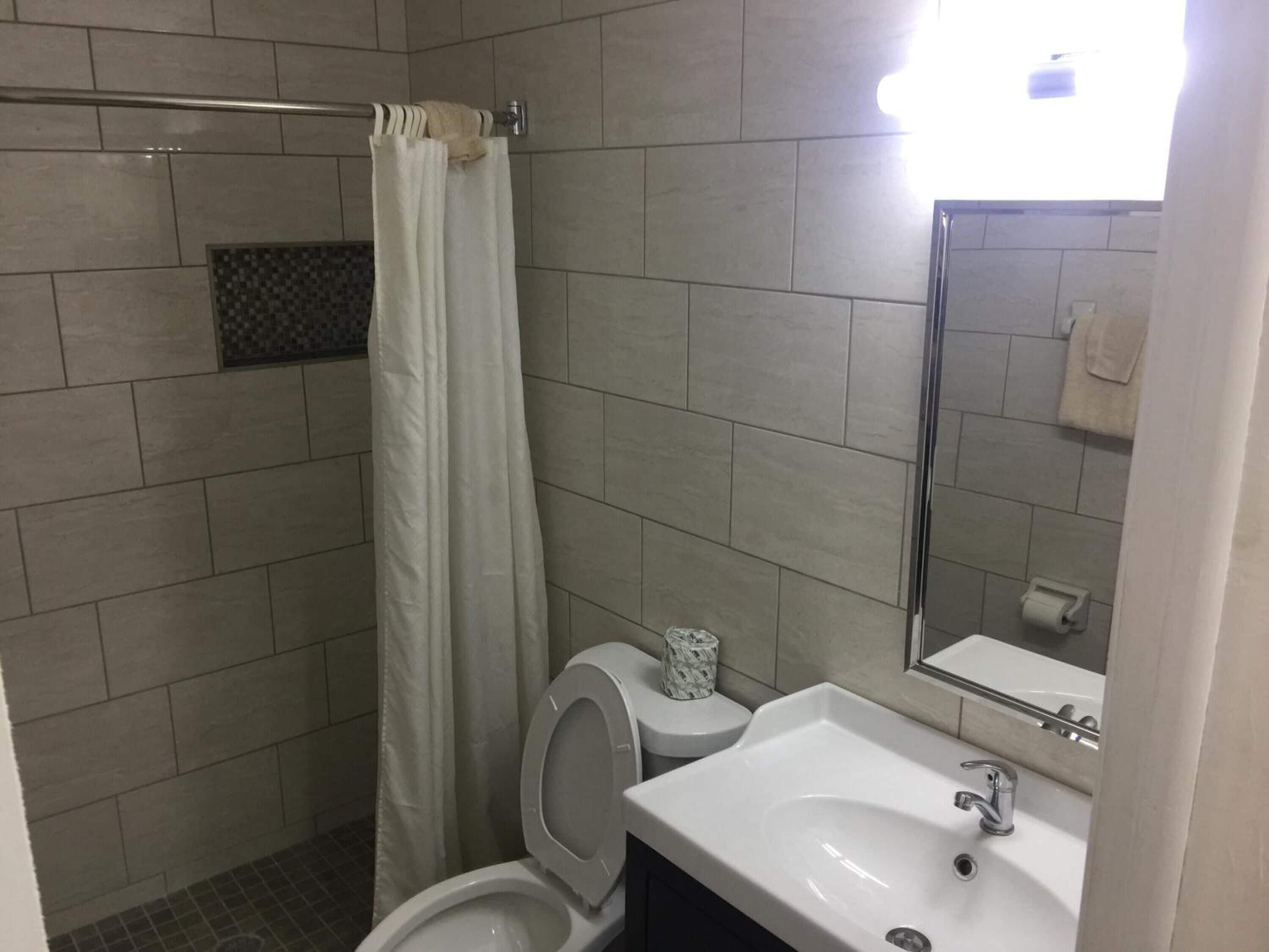 shower, free toiletries, towels, toilet paper