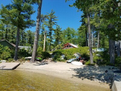 Adorable cottage set among tall pines with sandy beach -only .5  mile from town.