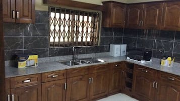 Apartment, 3 Bedrooms | Private kitchen | Full-sized fridge, microwave, oven, stovetop