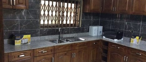 Apartment, 3 Bedrooms | Private kitchen | Full-sized fridge, microwave, oven, stovetop