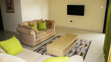 Apartment, 2 Bedrooms | Living room | Flat-screen TV