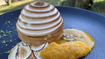 A dessert on a plate with a blue textured background.