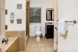 Combined shower/bathtub, hair dryer, towels, soap