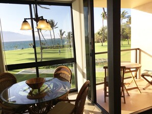 Enjoy a serene view of the golf course and palm trees from the balcony, where you can relax in the wicker chairs.