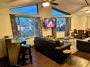 Executive House, Multiple Beds, Kitchen, Lake View | Living area | 50-inch Smart TV with digital channels