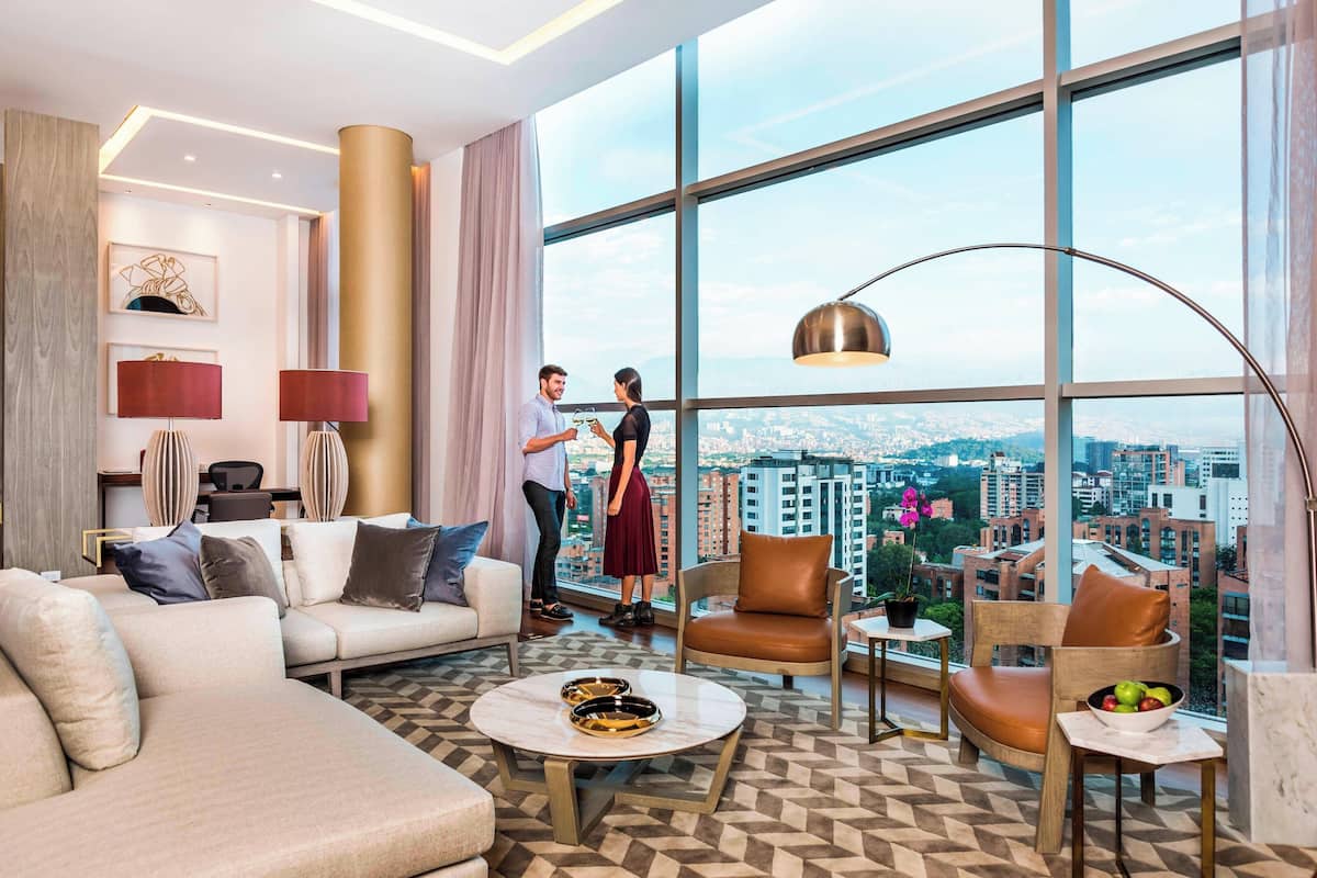 presidential suite, 1 king bed | living room | 50-inch smart tv with cable channels, tv, netflix