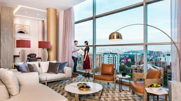 Presidential Suite, 1 King Bed | Living room | 50-inch Smart TV with cable channels, TV, Netflix