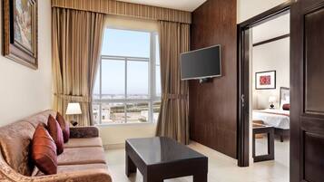 Room, 1 King Bed, Accessible, Smoking | In-room safe, desk, laptop workspace, iron/ironing board