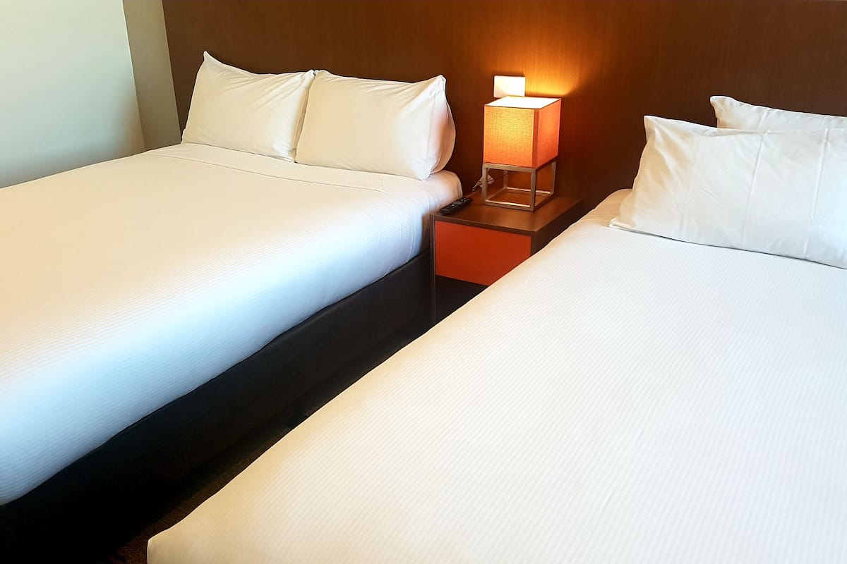 standard twin room, multiple beds | in-room safe, desk, soundproofing, iron/ironing board