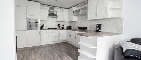 Townhome, 4 Bedrooms | Private kitchen | Fridge, microwave, coffee/tea maker, cookware/dishes/utensils