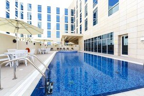 Outdoor pool, open 7:00 AM to 9:00 PM, pool umbrellas, sun loungers