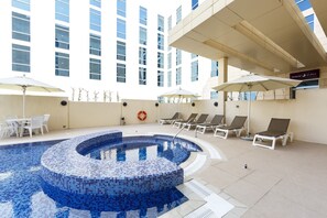 Outdoor pool, open 7:00 AM to 9:00 PM, pool umbrellas, pool loungers - Premier Inn Doha Education City (Al Rayyan)