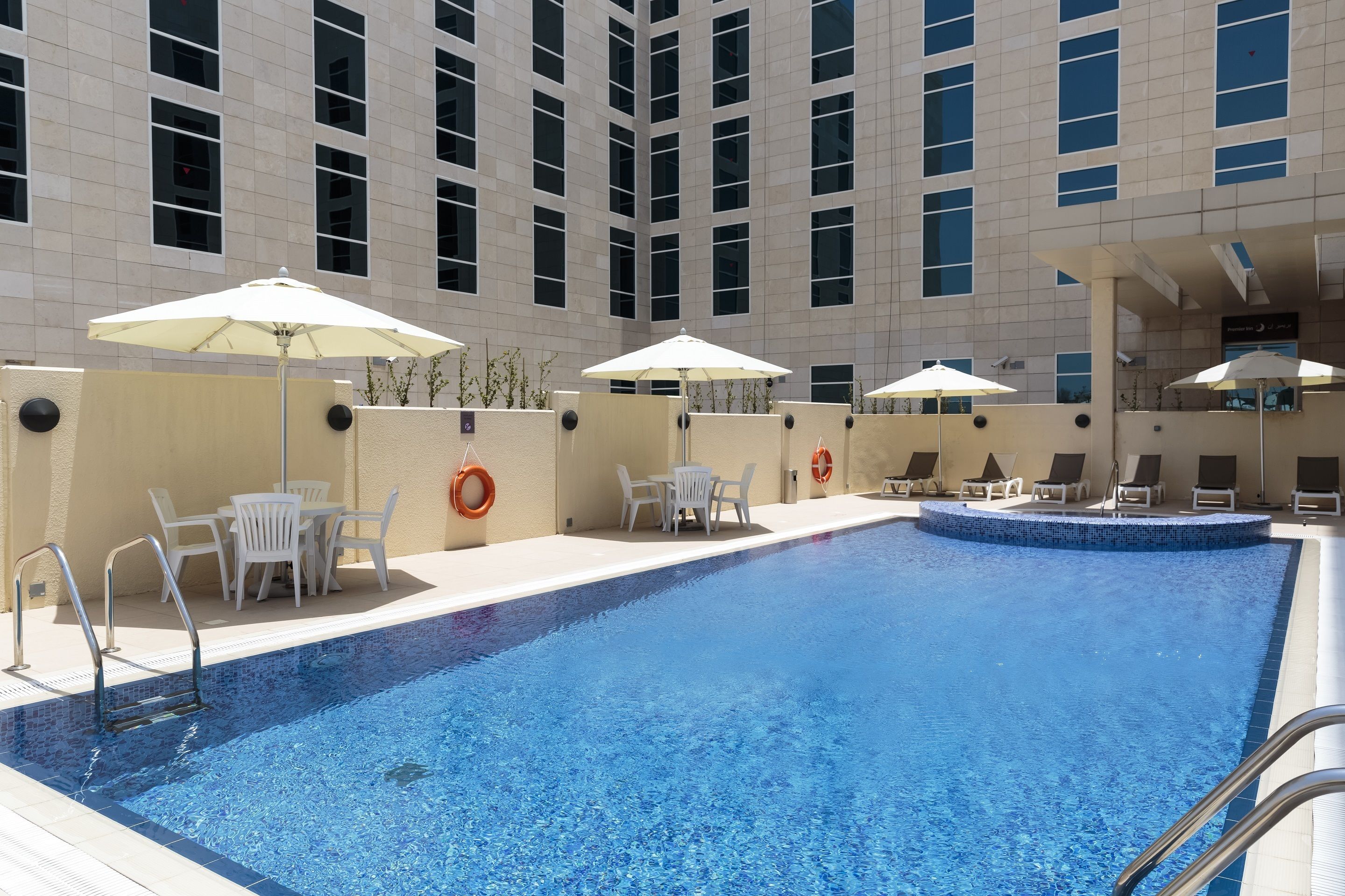outdoor pool, open 7:00 am to 9:00 pm, pool umbrellas, pool loungers