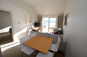 #68 Deluxe Waterfront Apartment | Living room | 60-inch TV with satellite channels