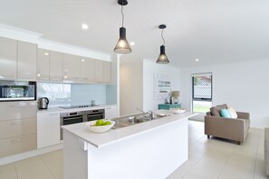 Sentosa at Tugun 5 Bedroom Waterfront  | Private kitchen | Full-size fridge, microwave, oven, stovetop - Sentosa at Tugun Beachfront Holiday Home (Tugun)