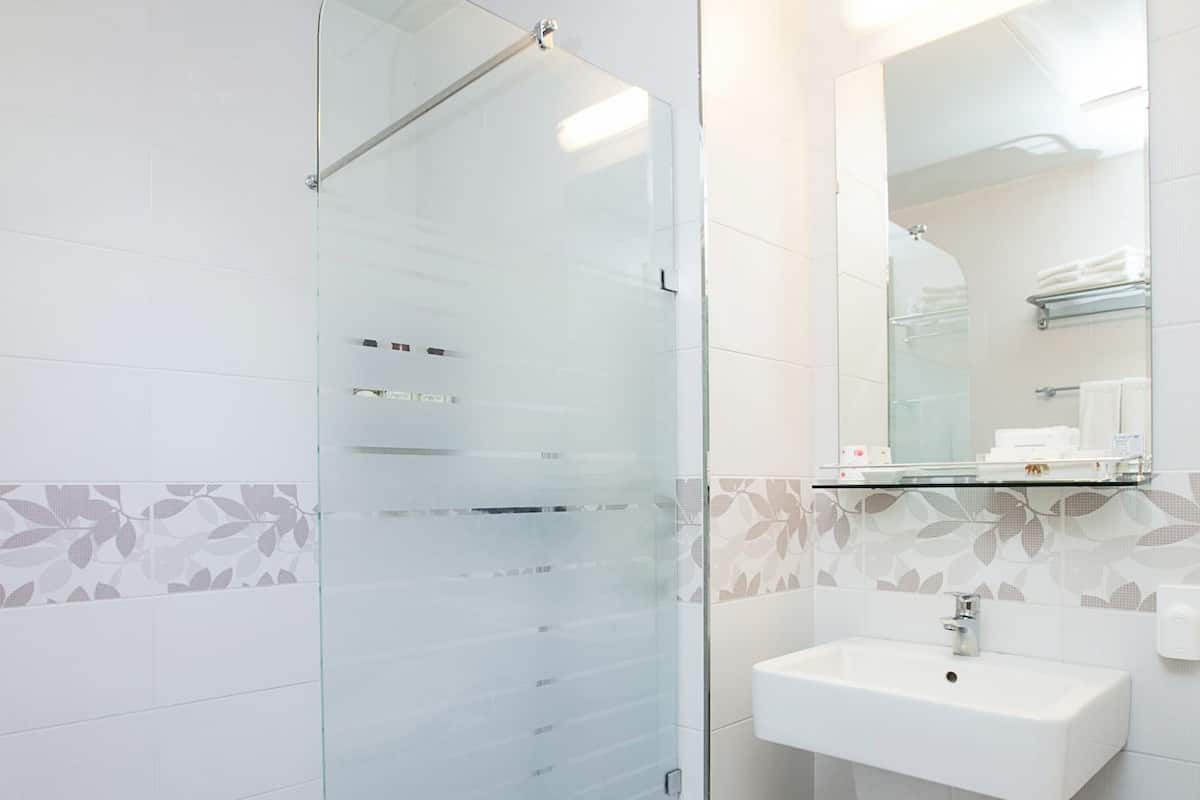 shower, slippers, bidet, towels