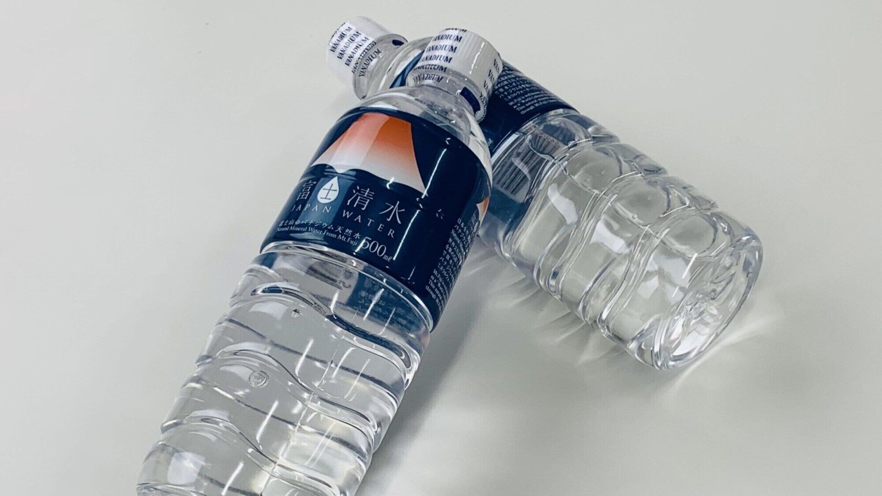 Two clear plastic bottles with labels, one of which is labeled "JAPAN WATER".