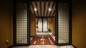 A traditional Japanese entrance with a tatami mat leading to a room. - Onyado Nono Nara Natural Hot Spring (Nara)