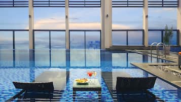 Outdoor pool, open 6:00 AM to 7:00 PM, pool loungers