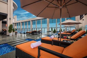 Outdoor pool, open 6:00 AM to 7:00 PM, pool loungers