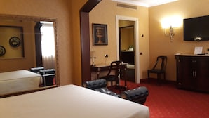 A hotel room with a bed, a desk, a chair, a television, and a wardrobe. - Hotel Motel Luna (Segrate)