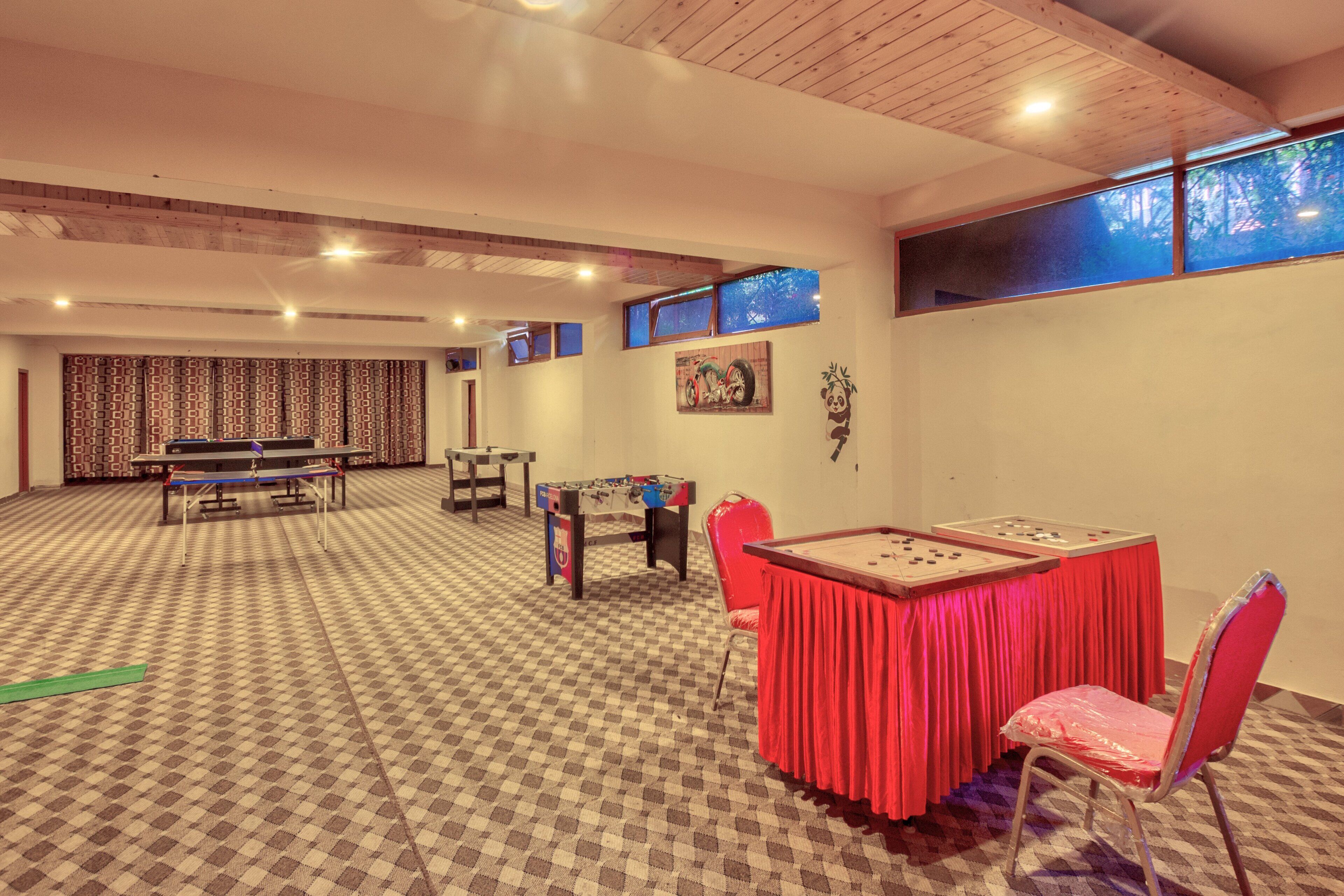 A room with a checkered carpet, a foosball table, a foosball table, a foosball table, a foosball table, a foosball table, a foosball table, a foosball table, a foosball table, a foosball table, a foosball table, a foosball table, a foosball table, a foosball table, a foosball table, a foosball table, a foosball table, a foosball table, a foosball table, a foosball table, a foosball table, a foosball table, a foosball table, a foosball table, a foosball table, a foosball table, a foosball table, a foosball table, a foosball table, a foosball table, a foosball table, a foosball table, a foos