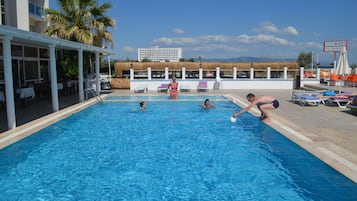 Seasonal outdoor pool, pool umbrellas, pool loungers