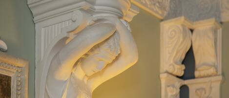 A detailed architectural column with intricate carvings.