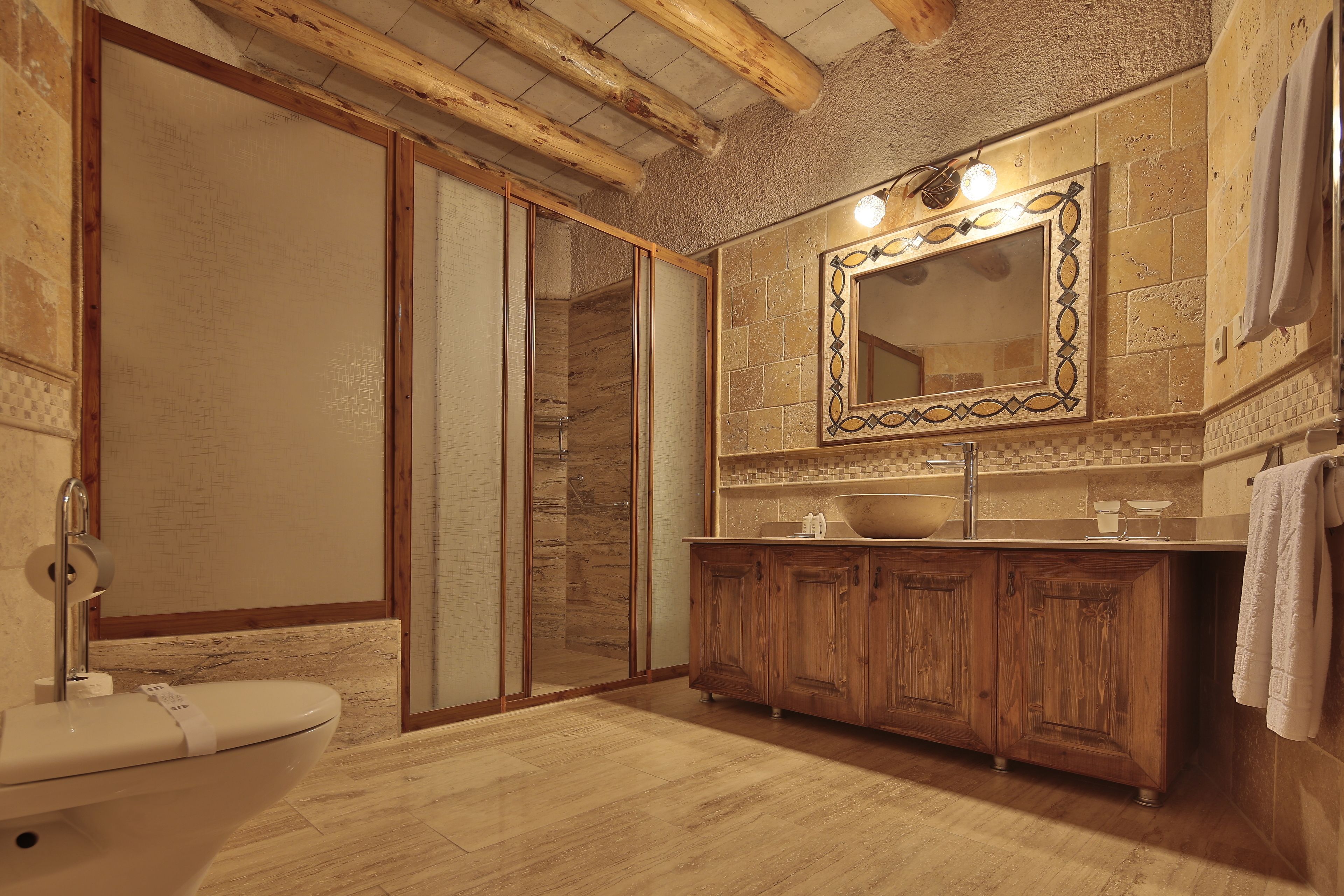 Deluxe Room | Bathroom | Hair dryer, slippers, towels, soap