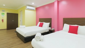 A hotel room with two beds, a wardrobe, an air conditioning unit, and a small table with a phone. - Hotel Sunjoy9 Bandar Sunway (Petaling Jaya)