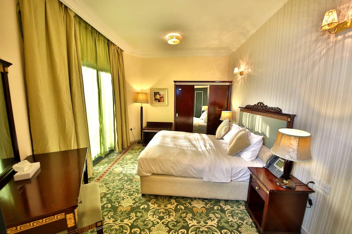 Deluxe Apartment, 1 Bedroom (1 King Bed) | 1 bedroom, in-room safe, desk, iron/ironing board