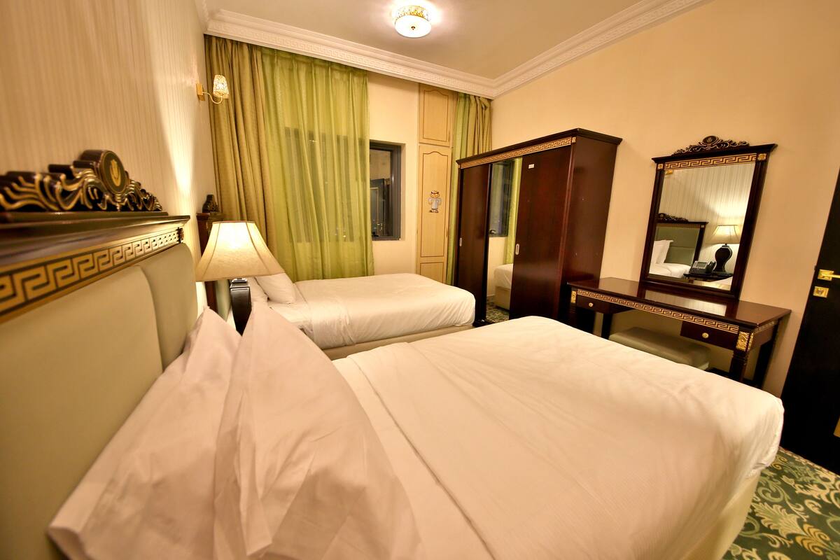 Deluxe Apartment, 1 Bedroom (Twin Bed) | 1 bedroom, in-room safe, desk, iron/ironing board