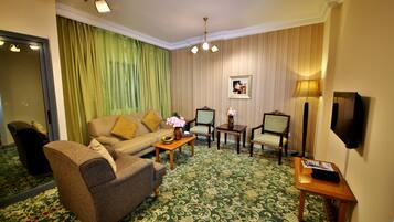 Deluxe Apartment, 1 Bedroom (1 Double Bed) | Living room | 40-inch LED TV with satellite channels, TV