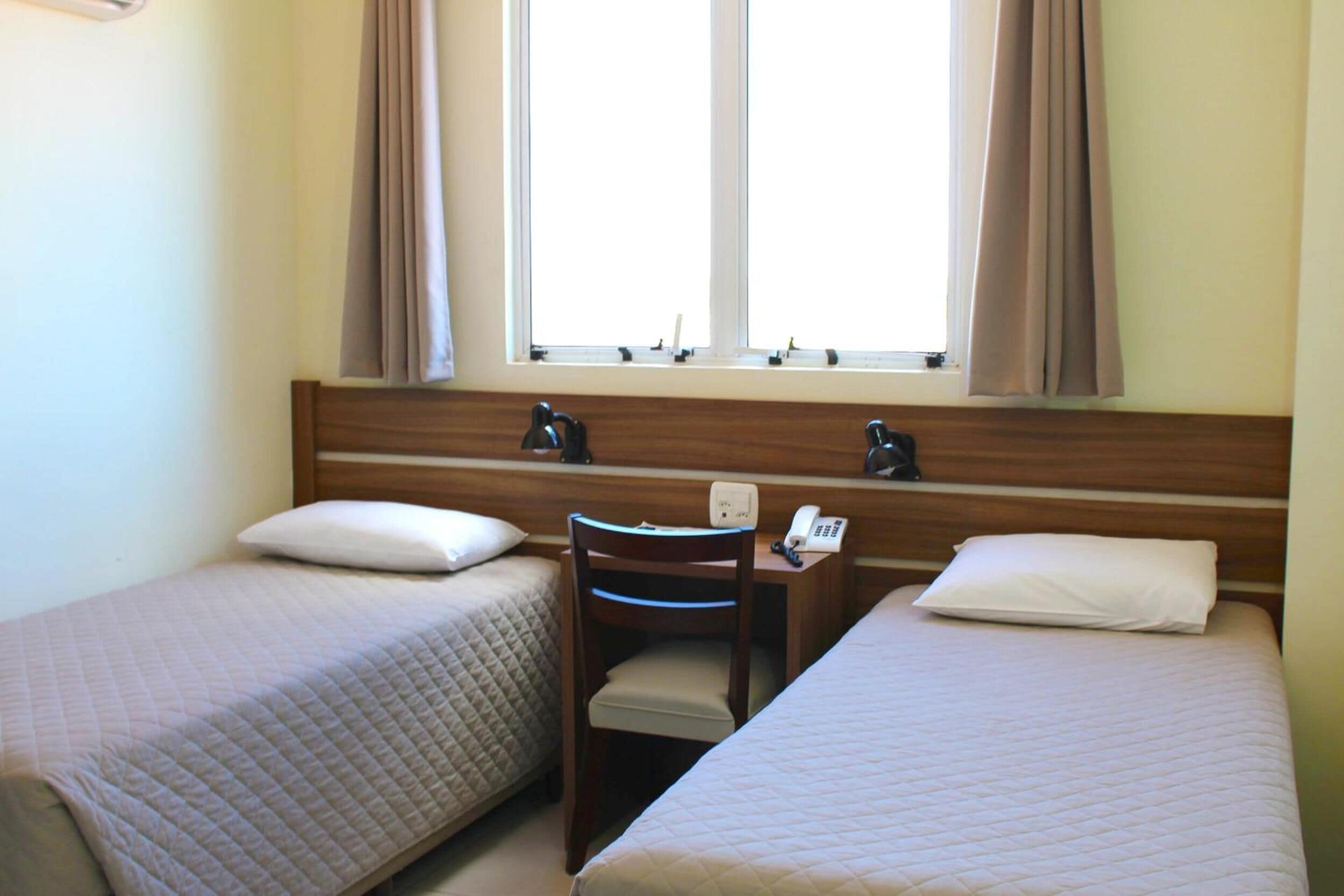 deluxe twin room | 1 bedroom, minibar, desk, blackout curtains